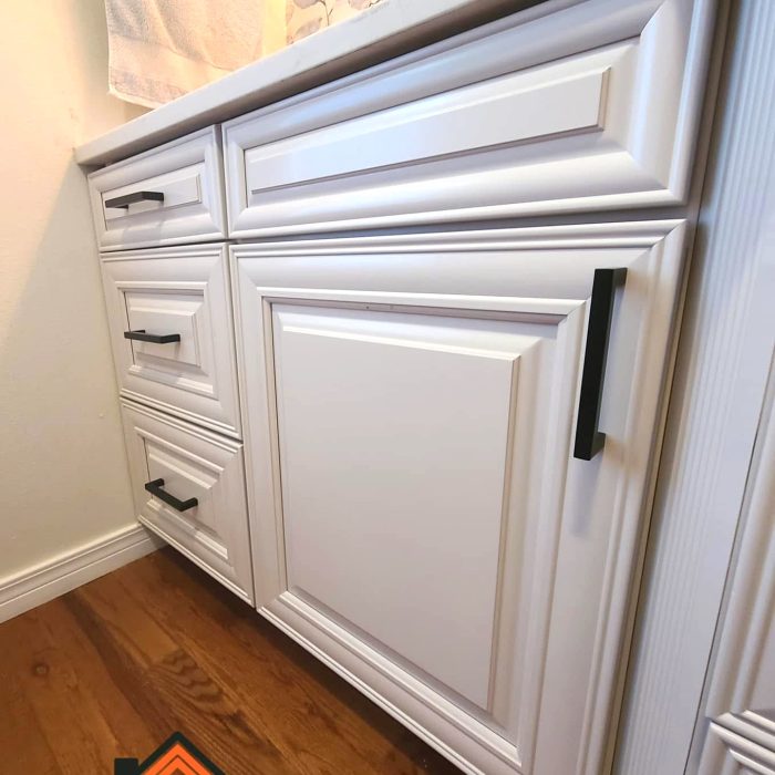 Bathroom vanity refinished to a sleek white finish